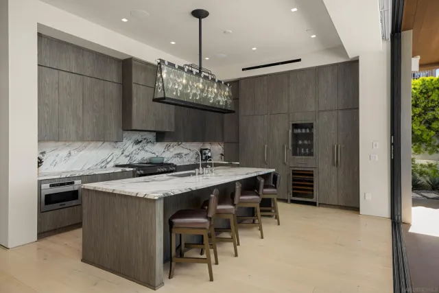 a kitchen with a table and chairs in it