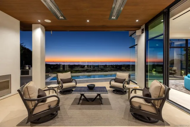 a view of balcony with couch and chairs