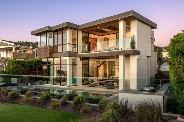 a view of a house with sitting area and garden