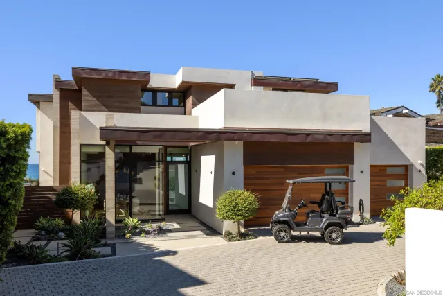 an aerial view of residential houses with outdoor space and swimming pool