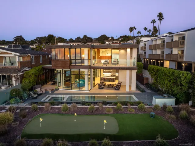 a view of a swimming pool with an outdoor seating and a mountain view