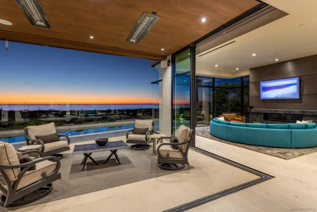 a outdoor living space with furniture and a flat screen tv