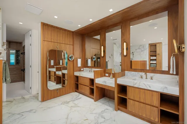 a bathroom with a double vanity sink and a mirror
