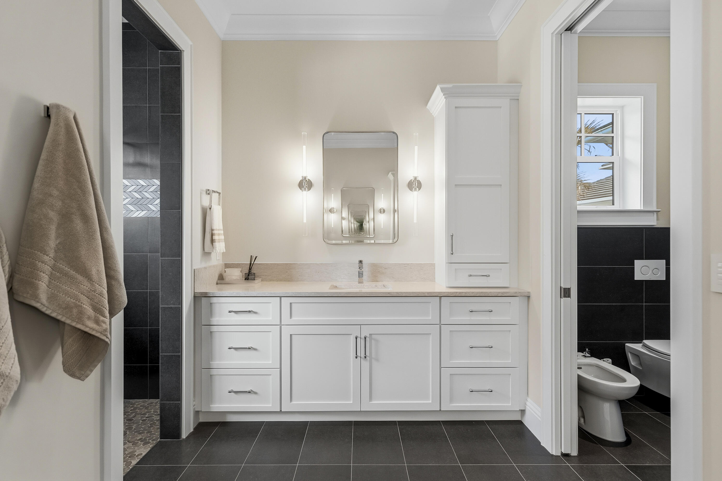 3973 Southeast Topsail Court Stuart, FL 34997 - Photo 11 of 38 a bathroom with a granite countertop sink a toilet and a mirror