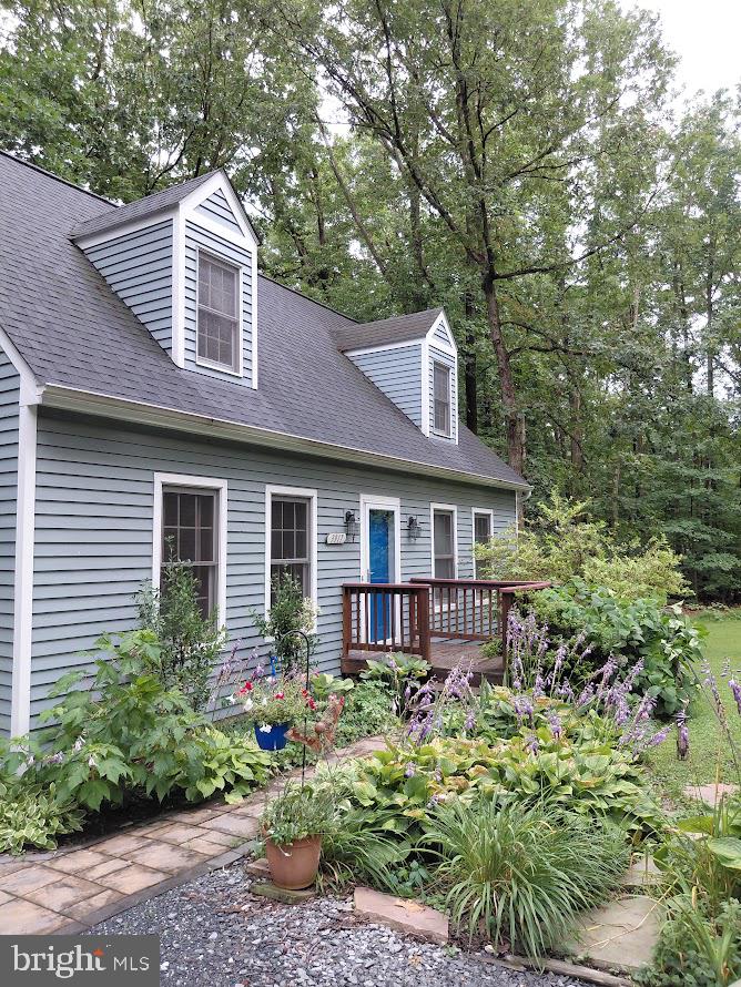 3917 Basford Road Frederick, MD 21703 - Photo 19 of 36 a front view of a house with a garden