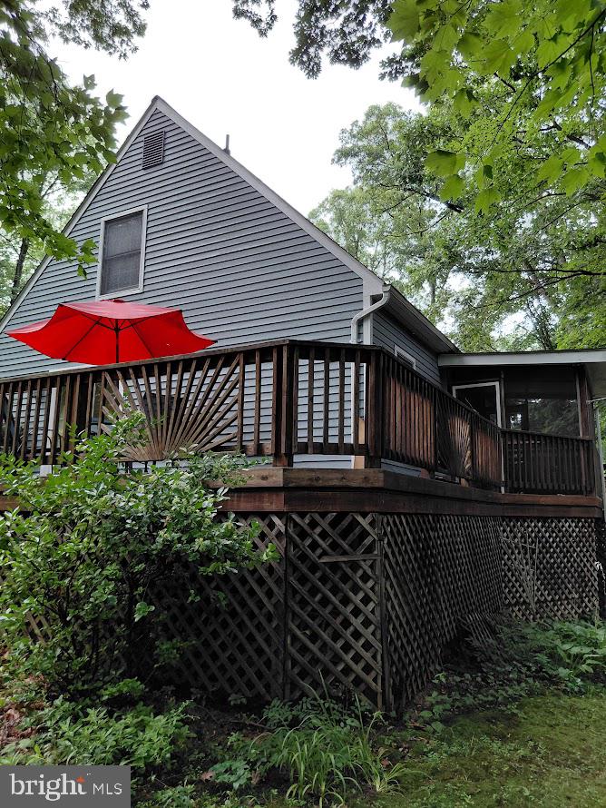 3917 Basford Road Frederick, MD 21703 - Photo 22 of 36 a front view of a house with yard and trees