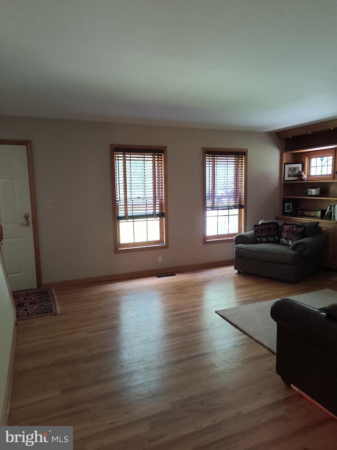3917 Basford Road Frederick, MD 21703 - Photo 29 of 36 a living room with furniture window and wooden floor