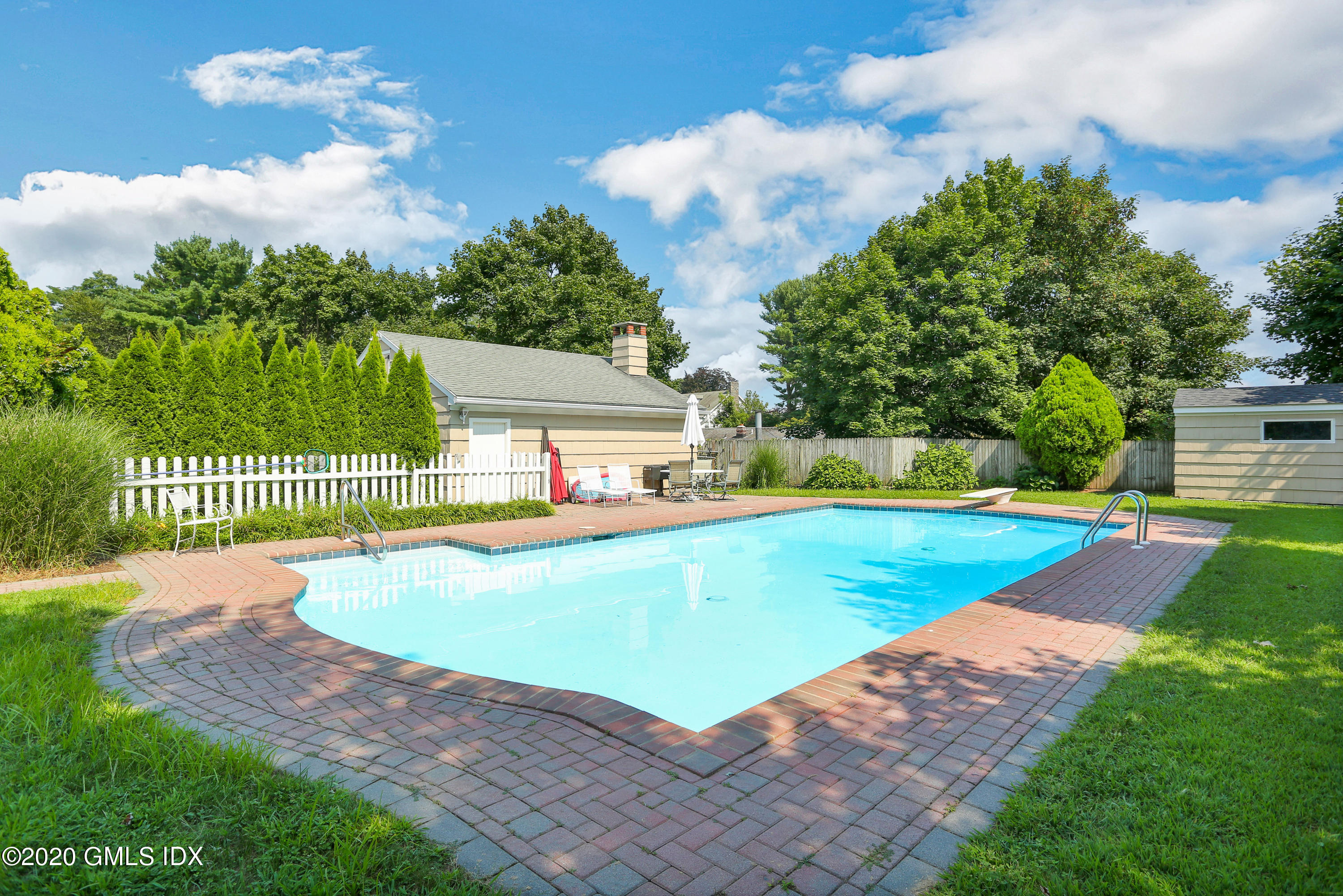 18 Norias Road Greenwich, CT 06830 - Photo 3 of 37 a view of a house with swimming pool and yard