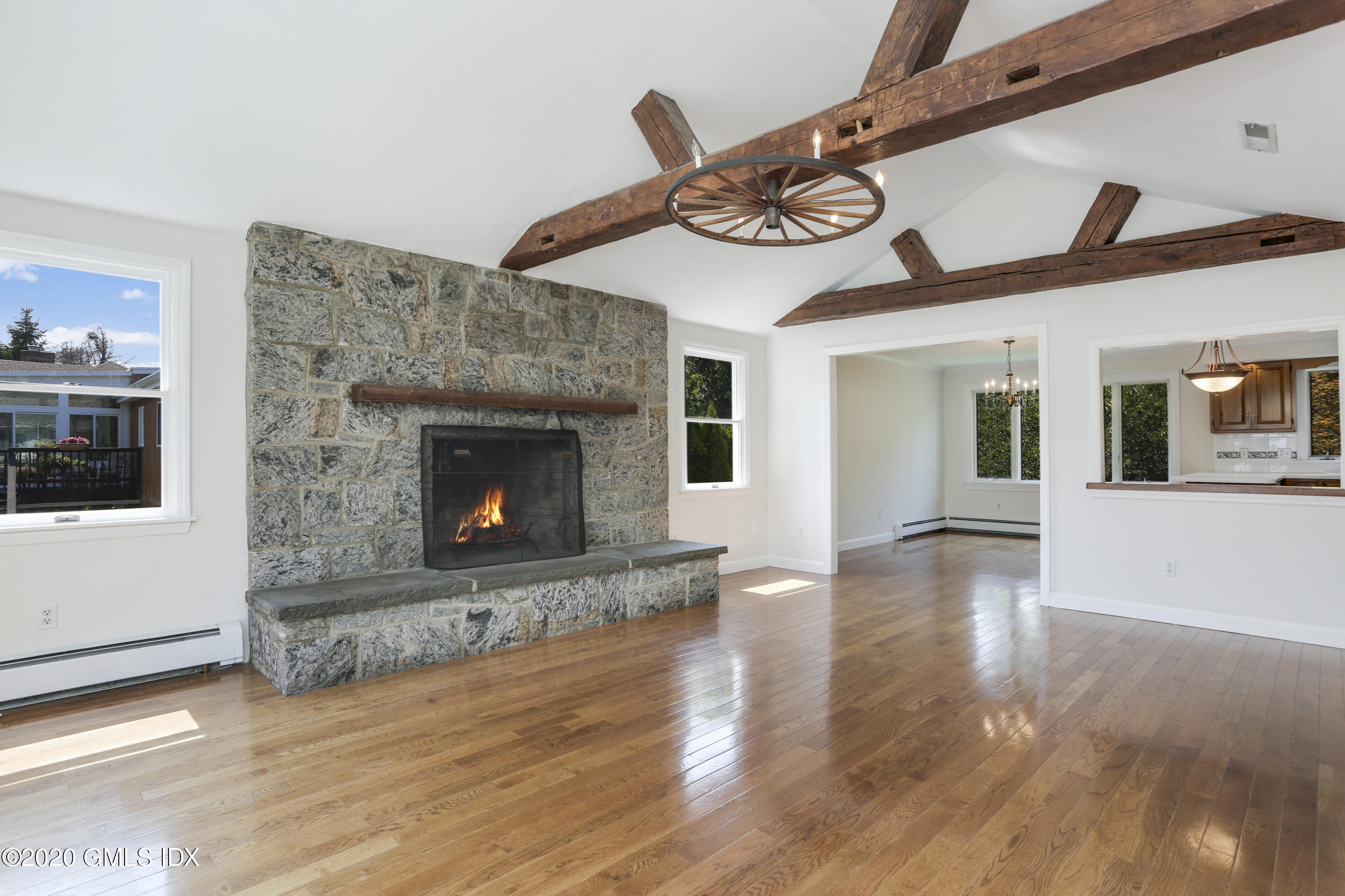 18 Norias Road Greenwich, CT 06830 - Photo 6 of 37 a view of a fireplace with wooden floor