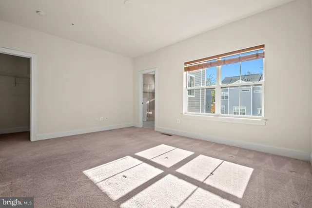 a view of an empty room with windows