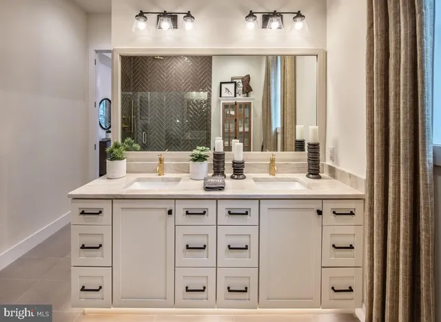 a bathroom with a sink vanity and a mirror