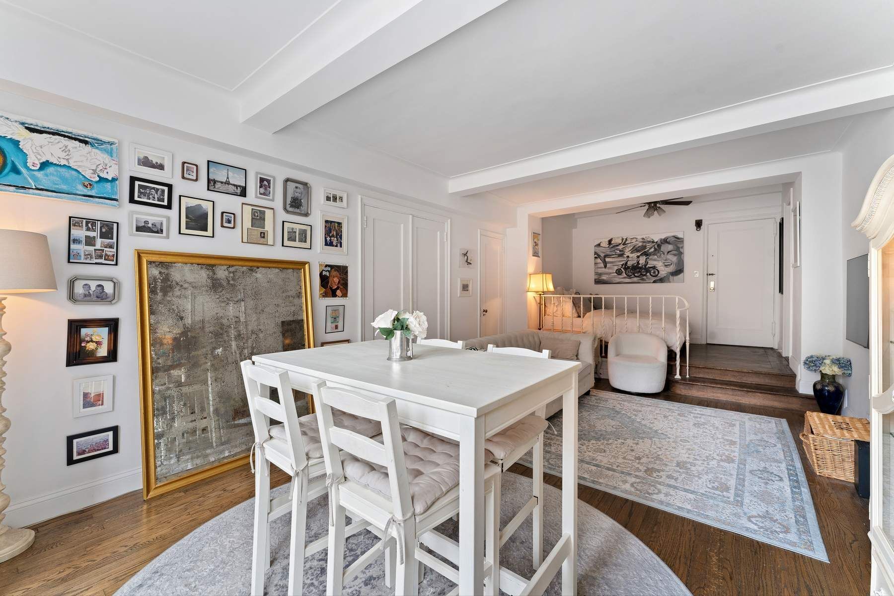 10 Park Avenue, Unit 10R Manhattan, NY 10016 - Photo 3 of 9 a view of a dining room with furniture and wooden floor