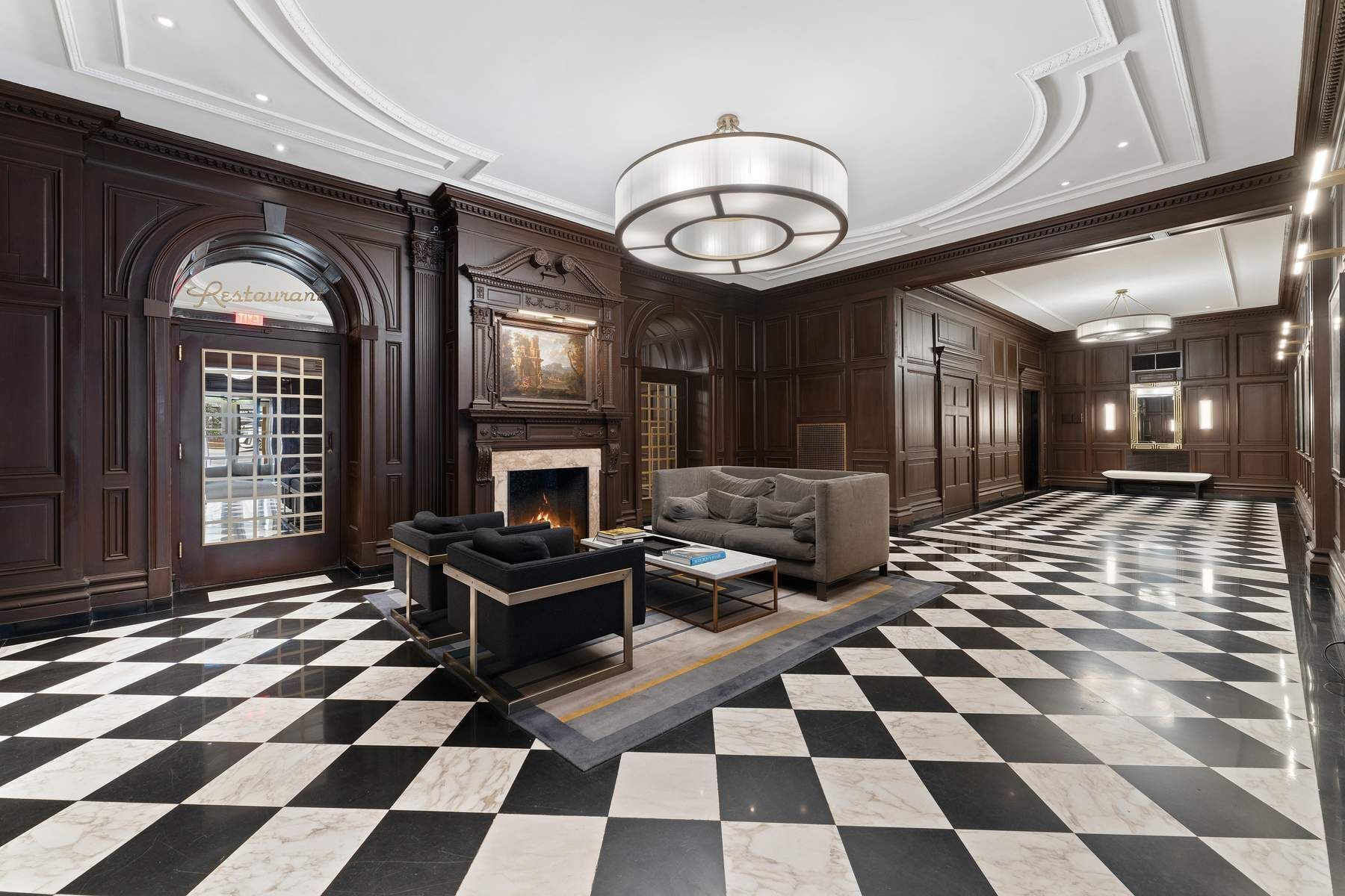 10 Park Avenue, Unit 10R Manhattan, NY 10016 - Photo 7 of 9 a living room with a black white checkered floor with couches chair and a coffee table