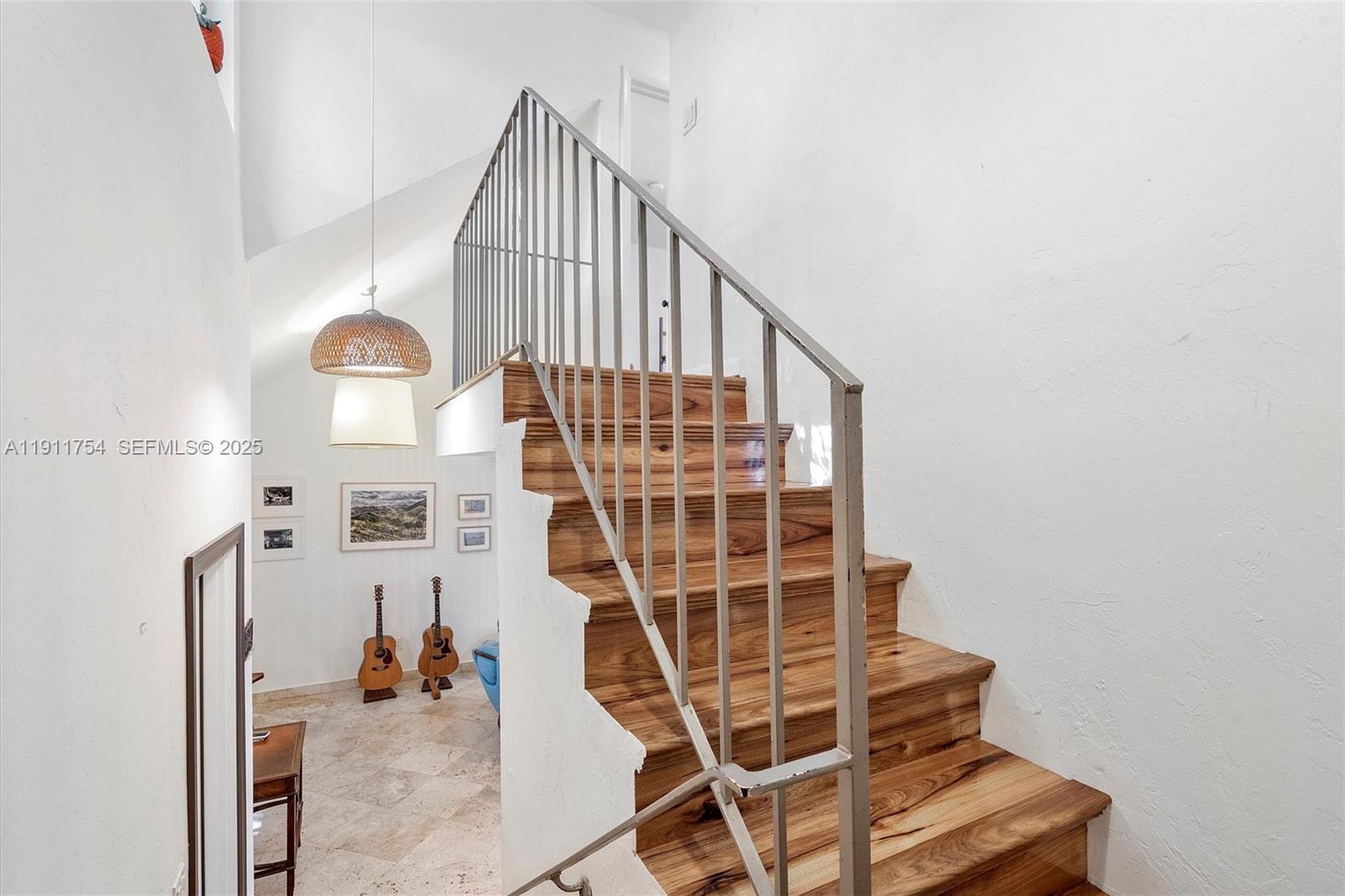 3235 McDonald Street, Unit 5 Miami, FL 33133 - Photo 2 of 35 a view of staircase with white walls and a window