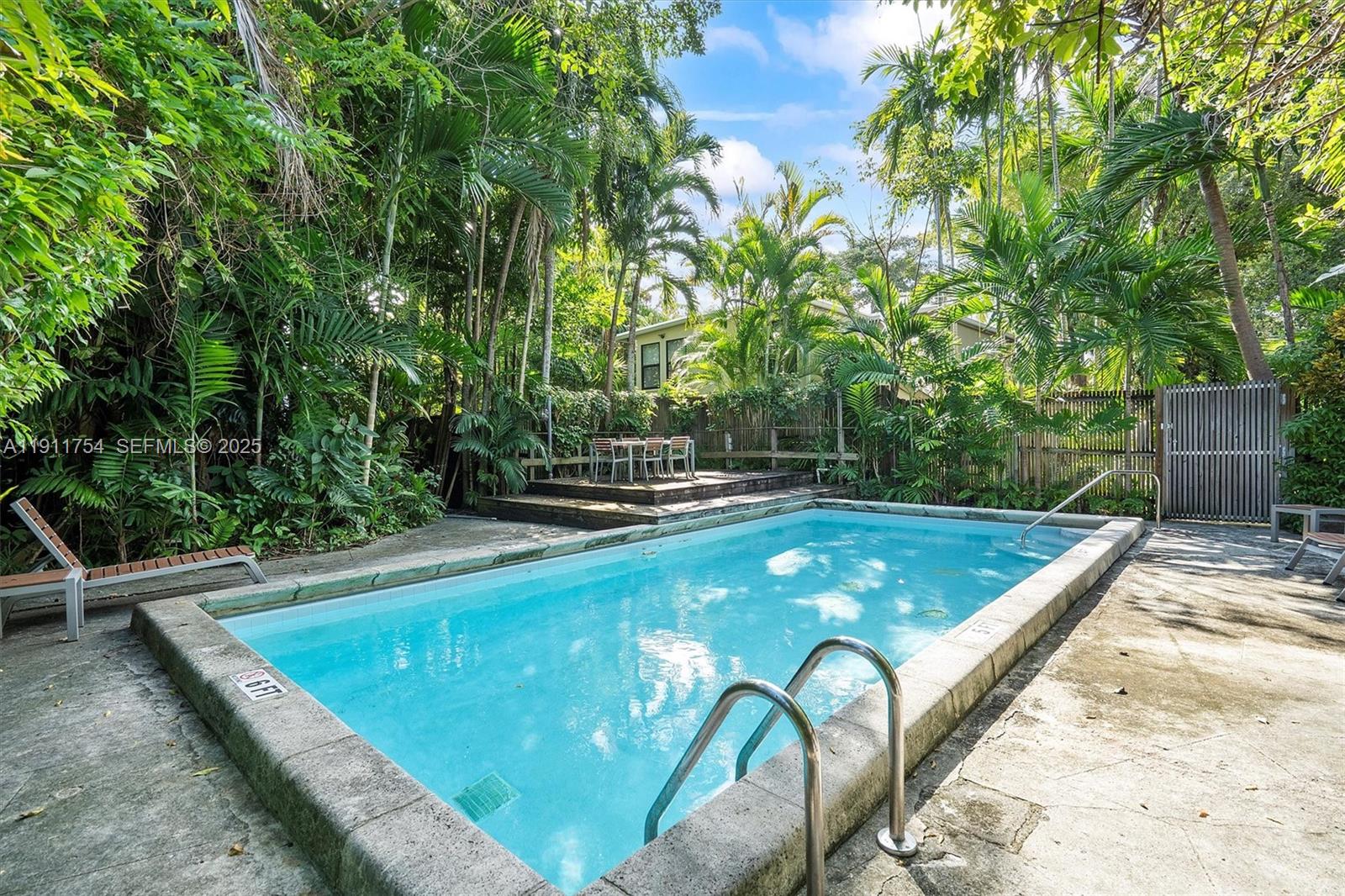 3235 McDonald Street, Unit 5 Miami, FL 33133 - Photo 34 of 35 a view of a backyard with swimming pool