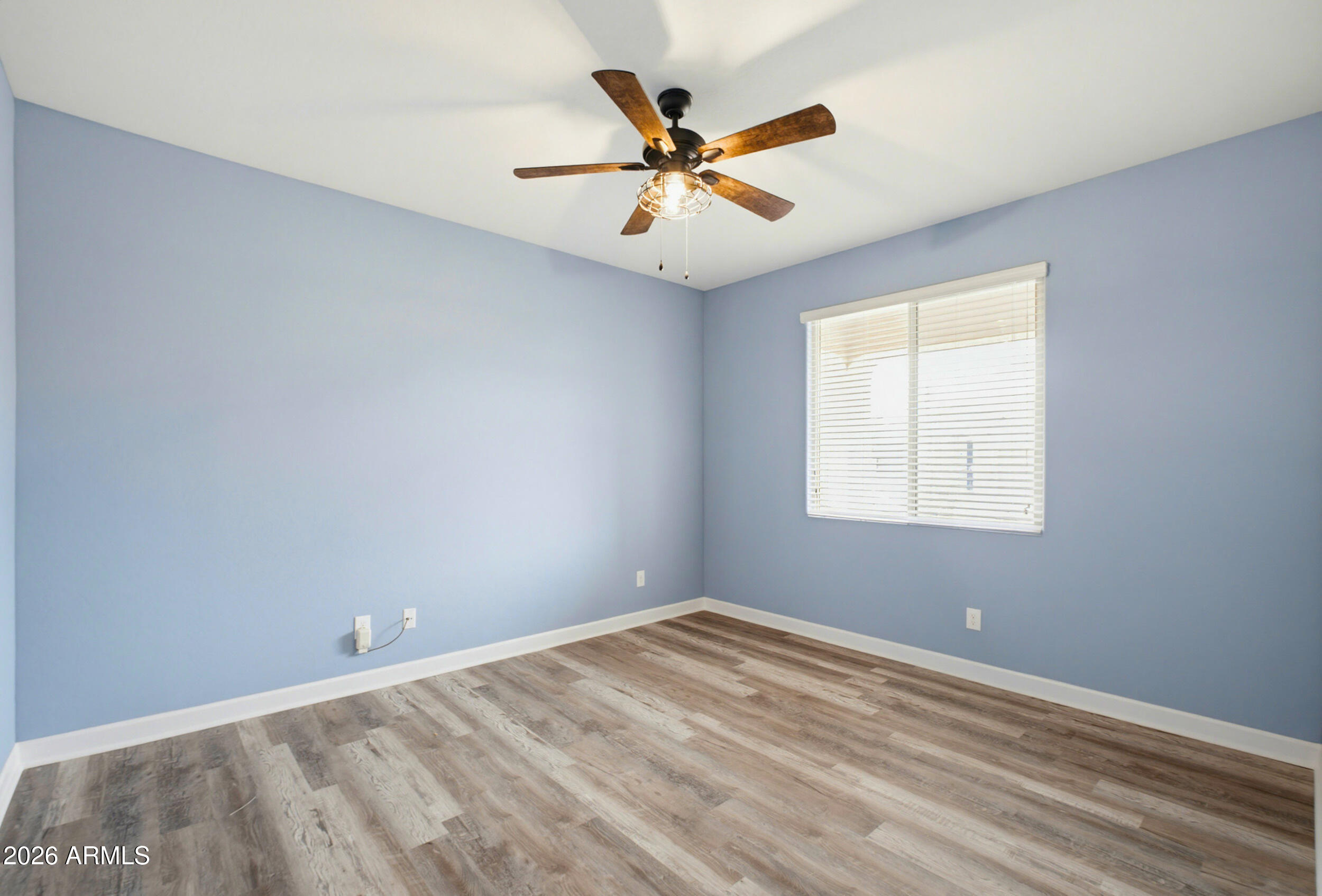 19995 North Ben Court Maricopa, AZ 85138 - Photo 9 of 51 an empty room with a window and a fan