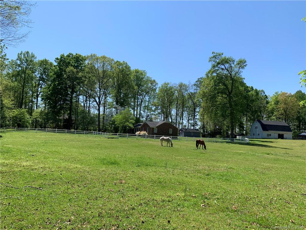 15015 Ranson Road Huntersville, NC 28078 - Photo 13 of 19 a view of park with trees and grass