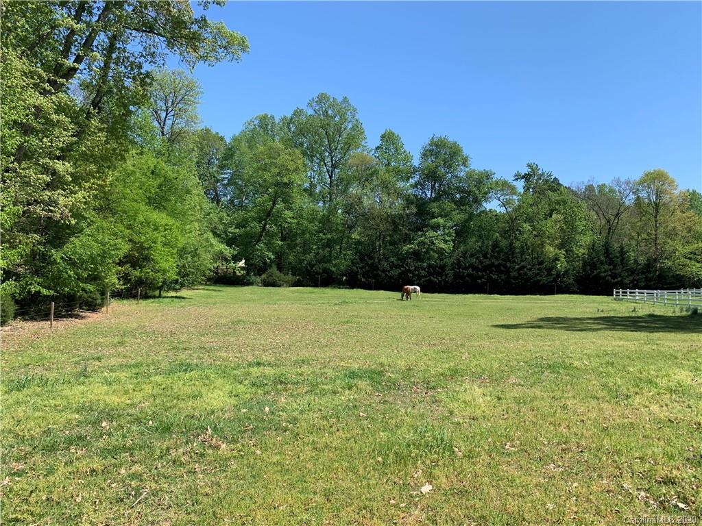 15015 Ranson Road Huntersville, NC 28078 - Photo 14 of 19 a view of a field with trees