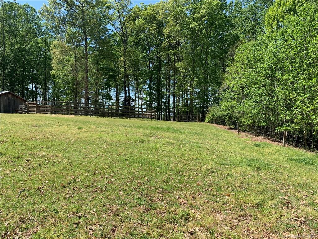 15015 Ranson Road Huntersville, NC 28078 - Photo 15 of 19 a view of a field with trees in the background