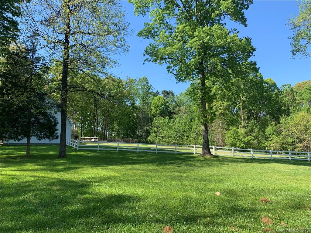 15015 Ranson Road Huntersville, NC 28078 - Photo 6 of 19 a view of a park with trees in the background