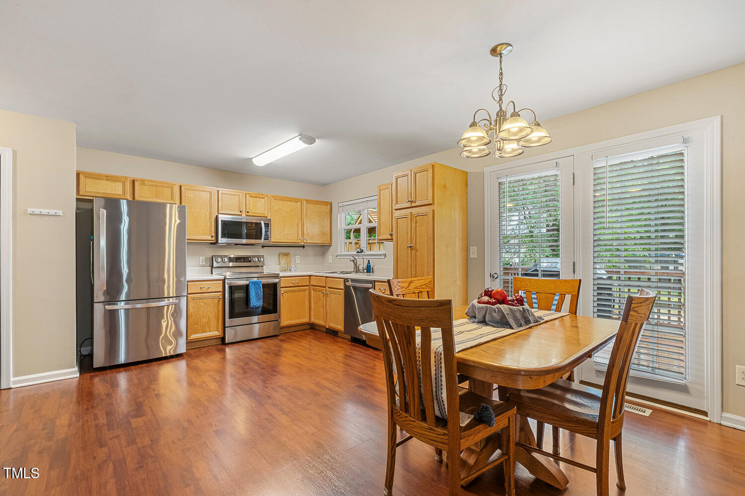1984 Sadler Avenue Creedmoor, NC 27522 - Photo 13 of 44 a view of a dining room with furniture window and wooden floor