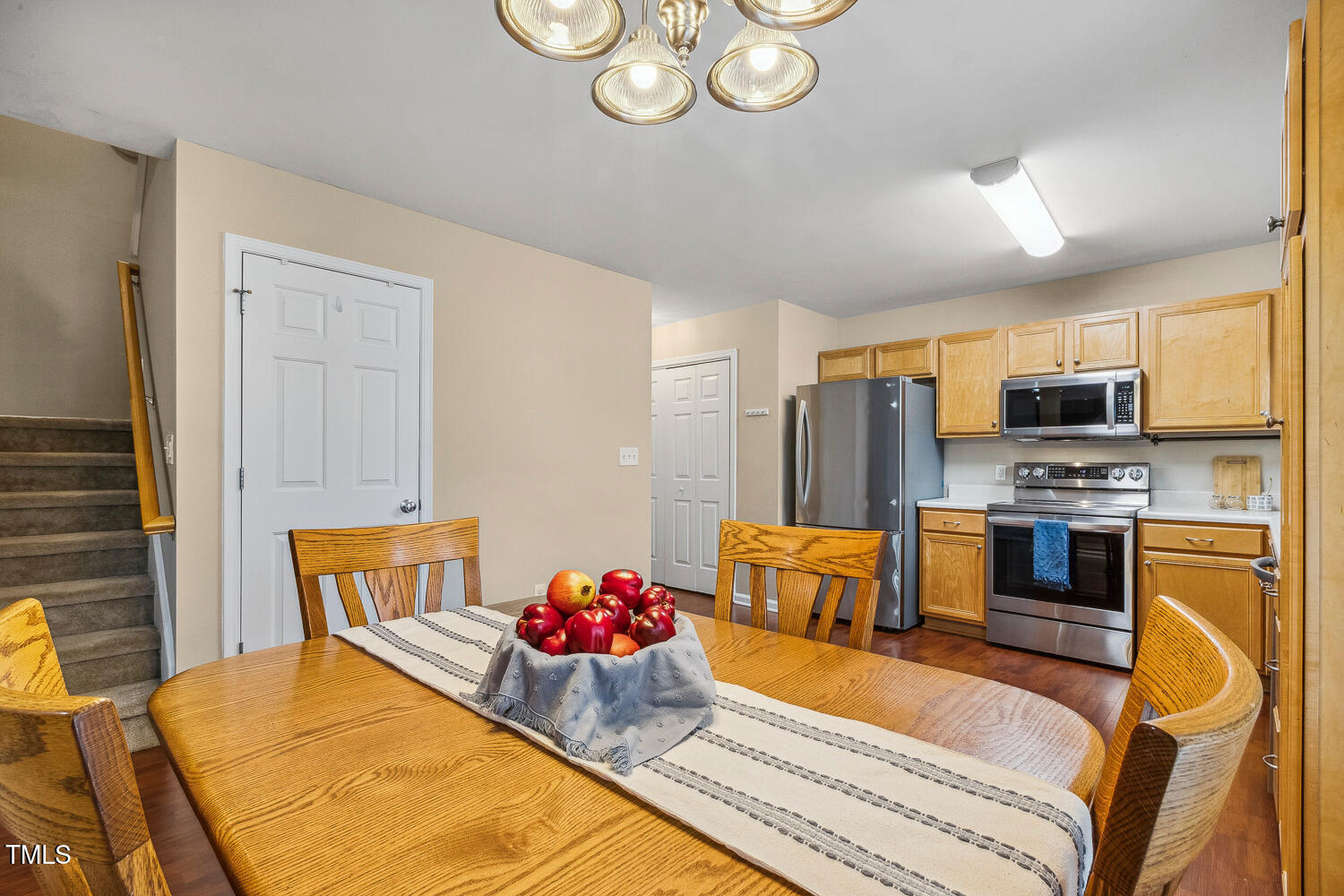 1984 Sadler Avenue Creedmoor, NC 27522 - Photo 16 of 44 a bedroom with a bed dresser and wooden floor