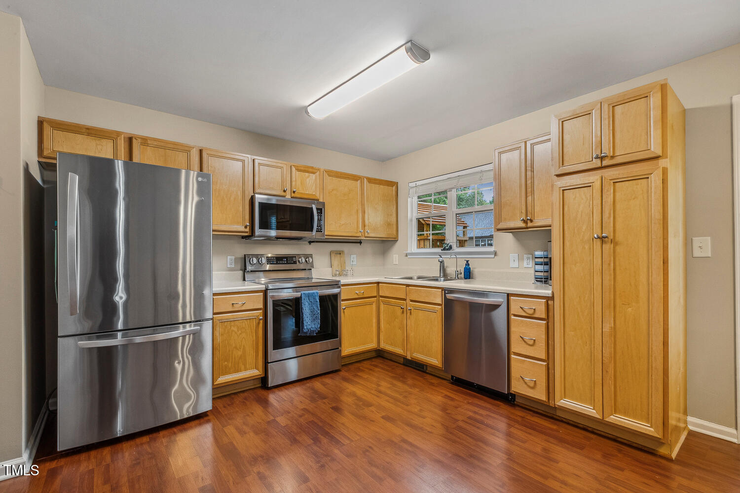 1984 Sadler Avenue Creedmoor, NC 27522 - Photo 17 of 44 a kitchen with stainless steel appliances granite countertop a refrigerator stove microwave and sink