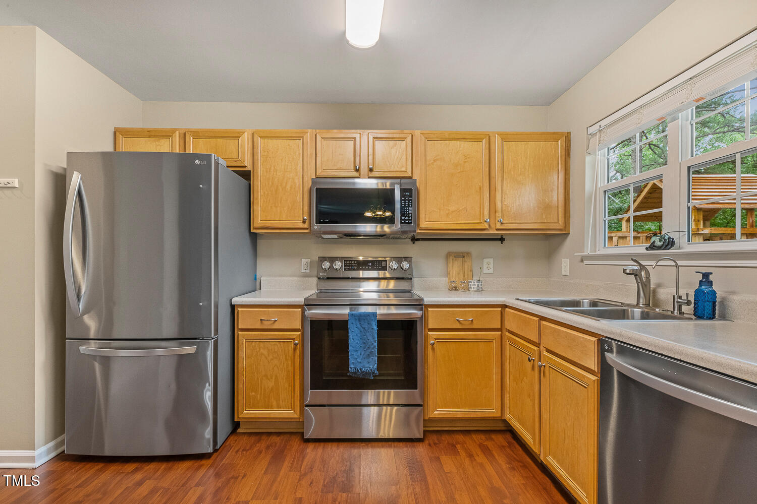 1984 Sadler Avenue Creedmoor, NC 27522 - Photo 18 of 44 a kitchen with appliances a sink and a window