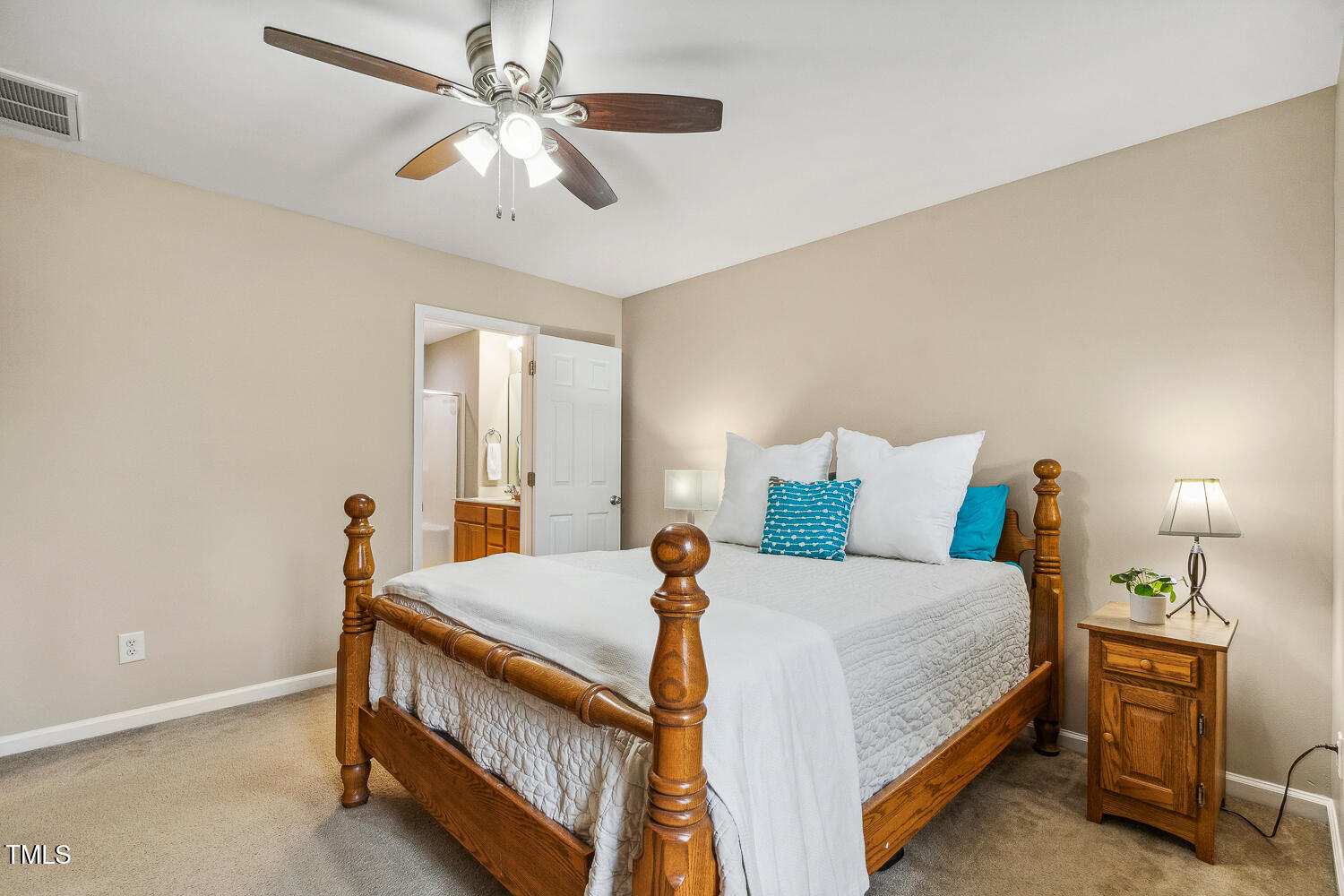 1984 Sadler Avenue Creedmoor, NC 27522 - Photo 24 of 44 a bedroom with a bed and a chandelier