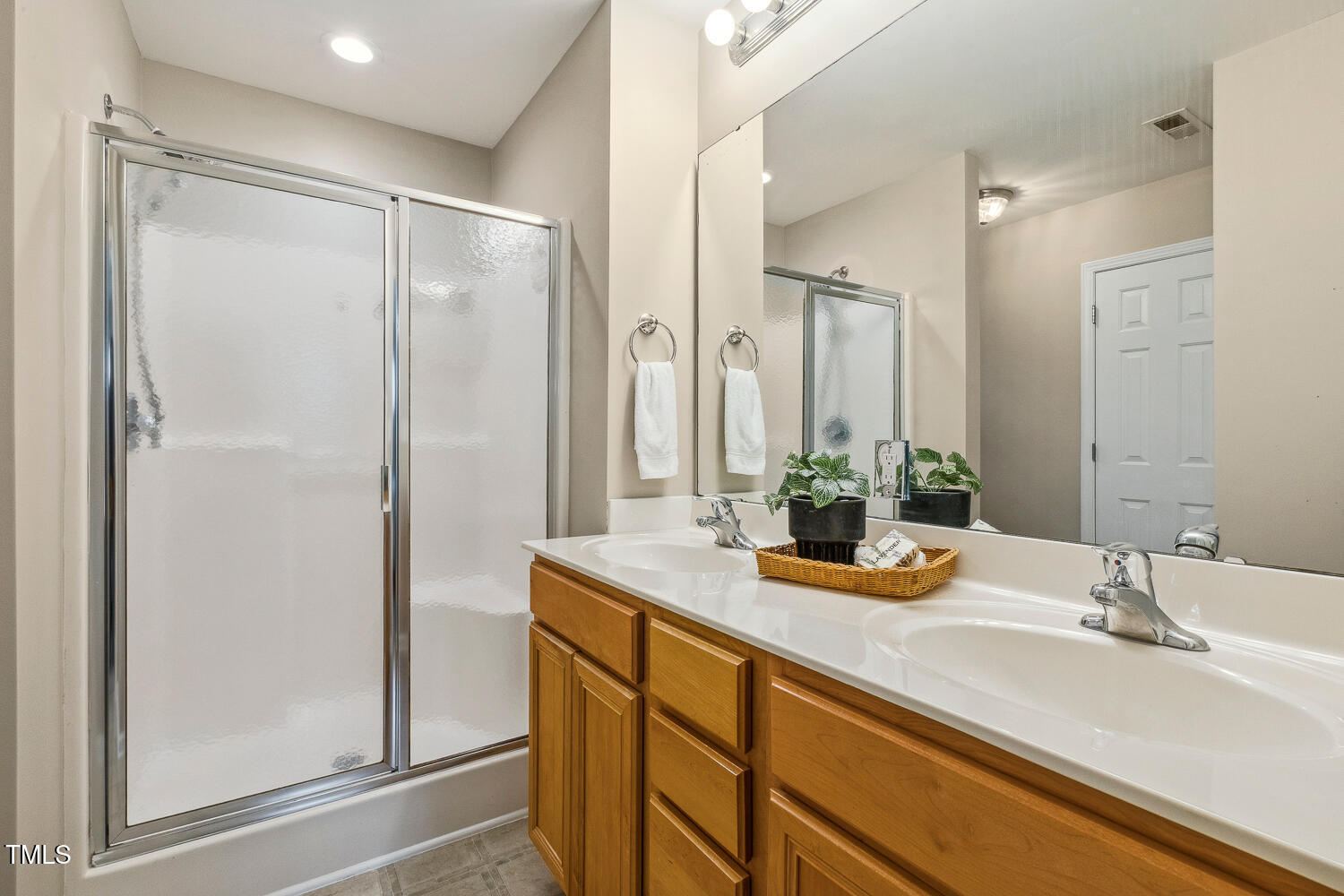 1984 Sadler Avenue Creedmoor, NC 27522 - Photo 26 of 44 a bathroom with a sink and a mirror