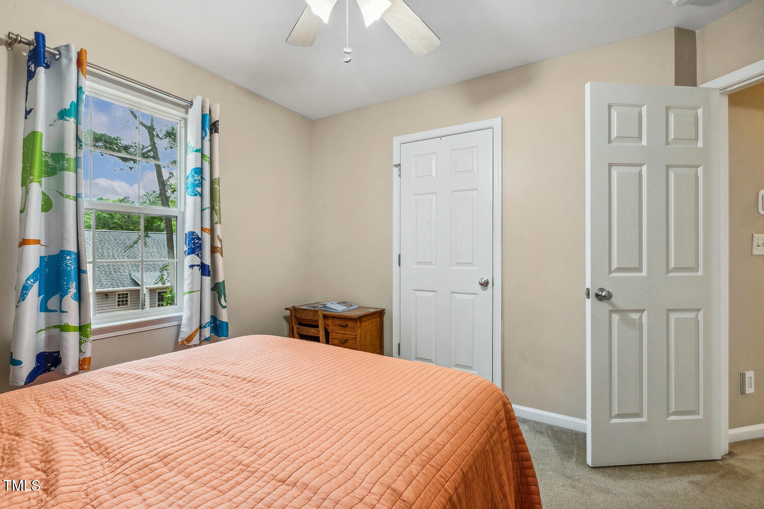 1984 Sadler Avenue Creedmoor, NC 27522 - Photo 28 of 44 a bedroom with a large bed and a chandelier