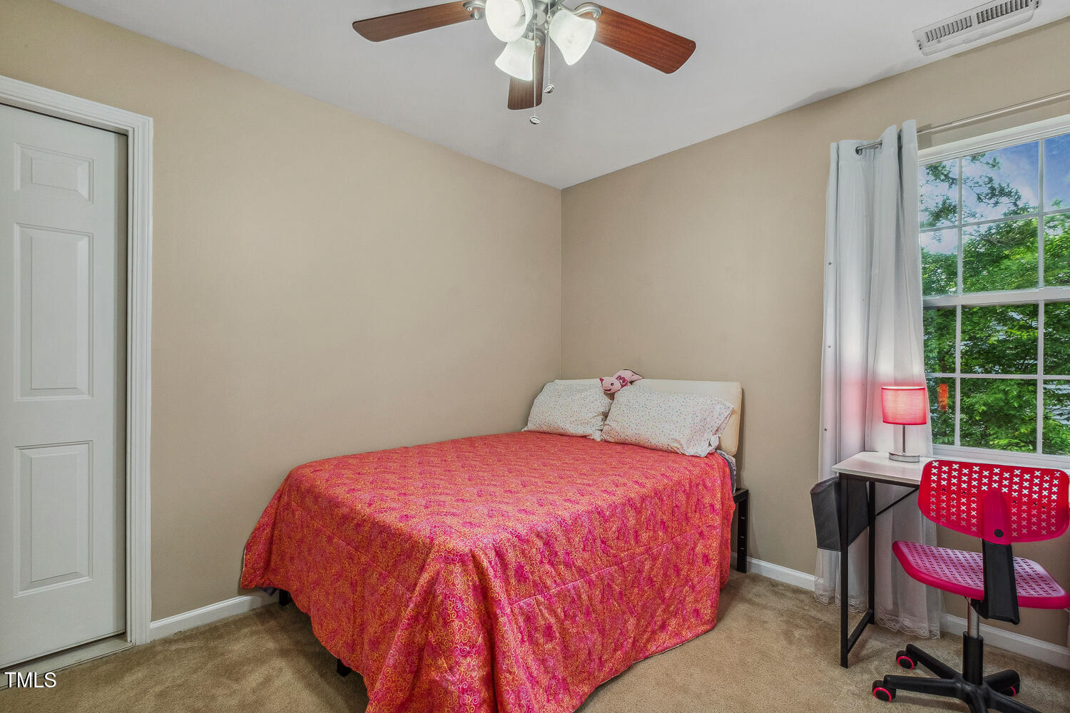 1984 Sadler Avenue Creedmoor, NC 27522 - Photo 30 of 44 a bedroom with a bed a chair and a large window