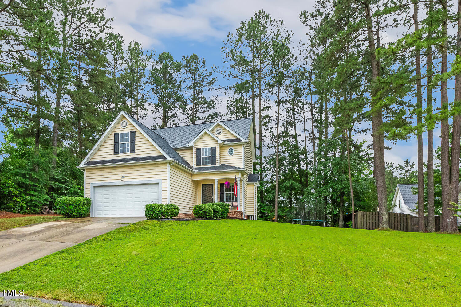 1984 Sadler Avenue Creedmoor, NC 27522 - Photo 3 of 44 a front view of a house with a yard and trees