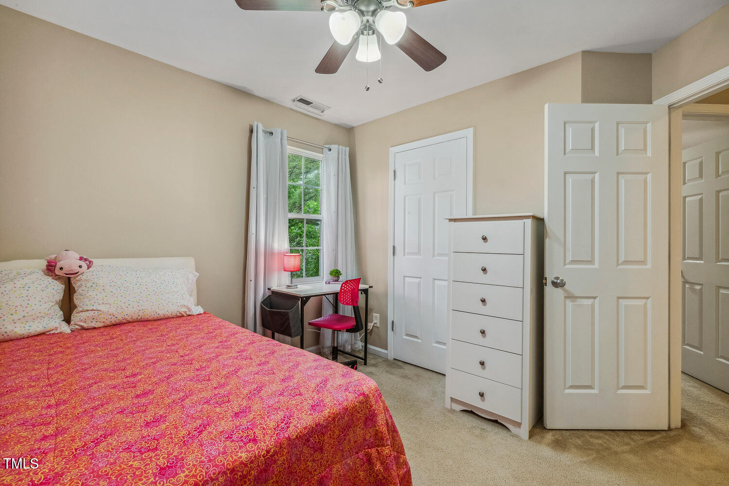 1984 Sadler Avenue Creedmoor, NC 27522 - Photo 31 of 44 a bedroom with a bed and a chandelier