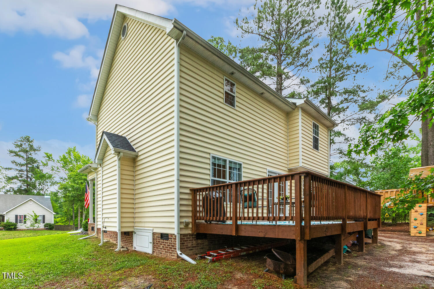 1984 Sadler Avenue Creedmoor, NC 27522 - Photo 36 of 44 a view of a house with a yard and a wooden deck