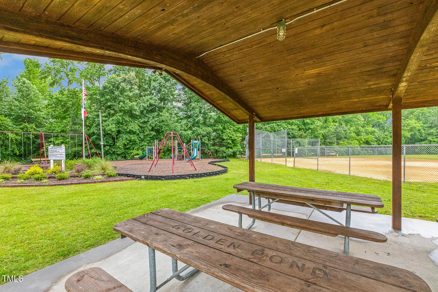 1984 Sadler Avenue Creedmoor, NC 27522 - Photo 40 of 44 a view of a garden with an outdoor seating