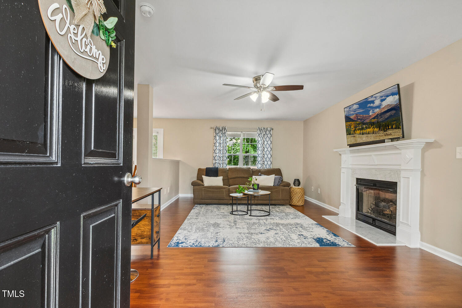 1984 Sadler Avenue Creedmoor, NC 27522 - Photo 5 of 44 a living room with furniture and a fireplace