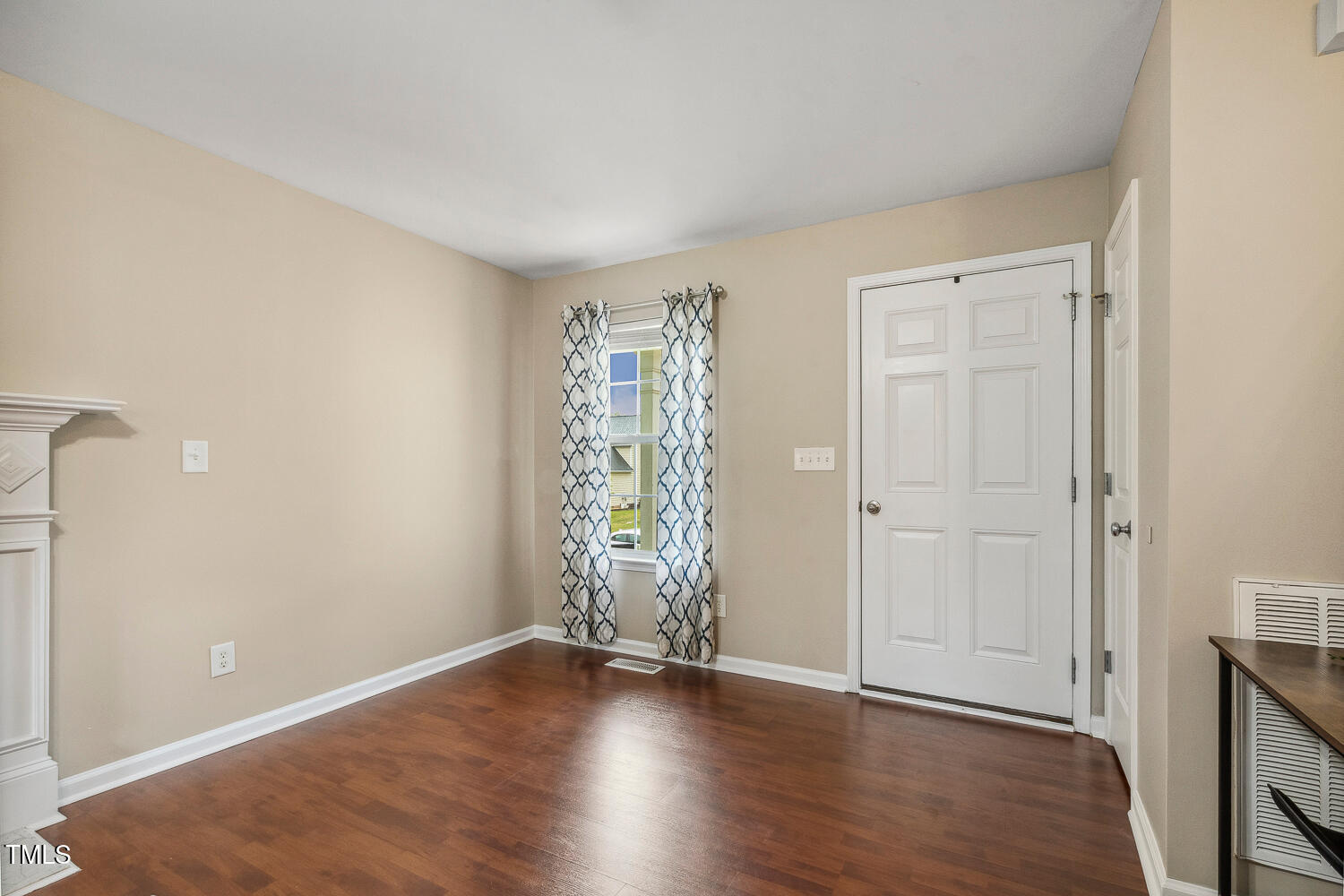 1984 Sadler Avenue Creedmoor, NC 27522 - Photo 6 of 44 an empty room with wooden floor and windows