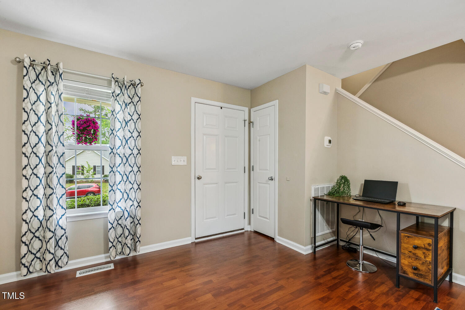 1984 Sadler Avenue Creedmoor, NC 27522 - Photo 7 of 44 a view of a workspace with furniture and wooden floor