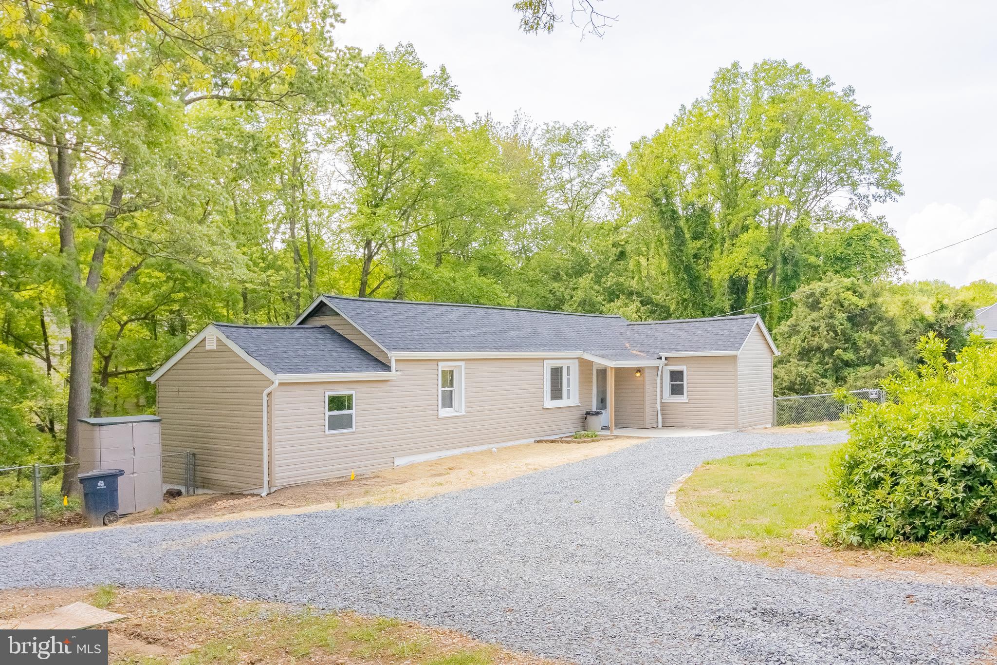 1816 Maple Lane Accokeek, MD 20607 - Photo 21 of 24 a aerial view of a house with swimming pool and trees all around
