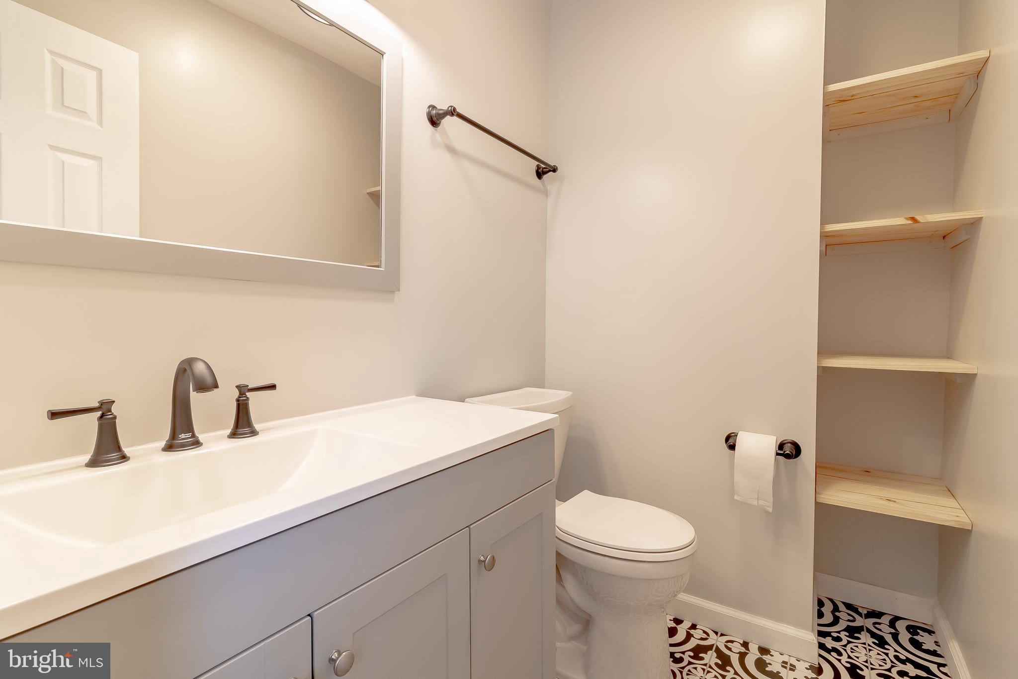 1816 Maple Lane Accokeek, MD 20607 - Photo 7 of 24 a bathroom with a sink a toilet and shower