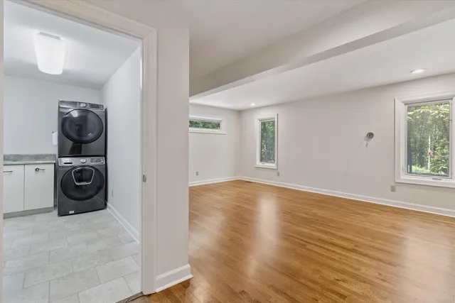 a view of a bedroom with washer and dryer