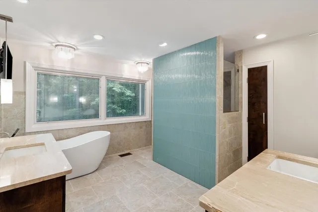 a bathroom with a bathtub and a sink