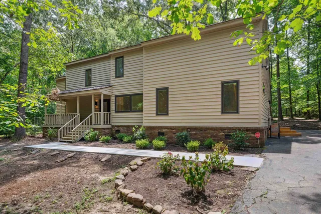 a front view of a house with garden