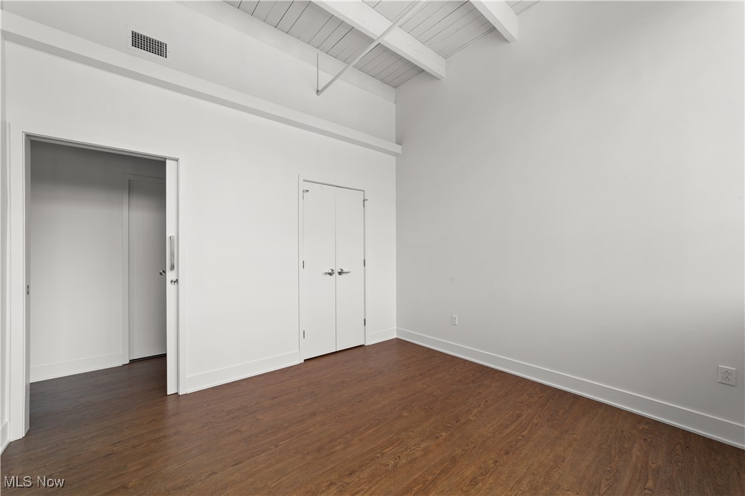 2048 Fulton Road, Unit 107 Cleveland, OH 44113 - Photo 30 of 37 Bedroom with wood look flooring and closet storage