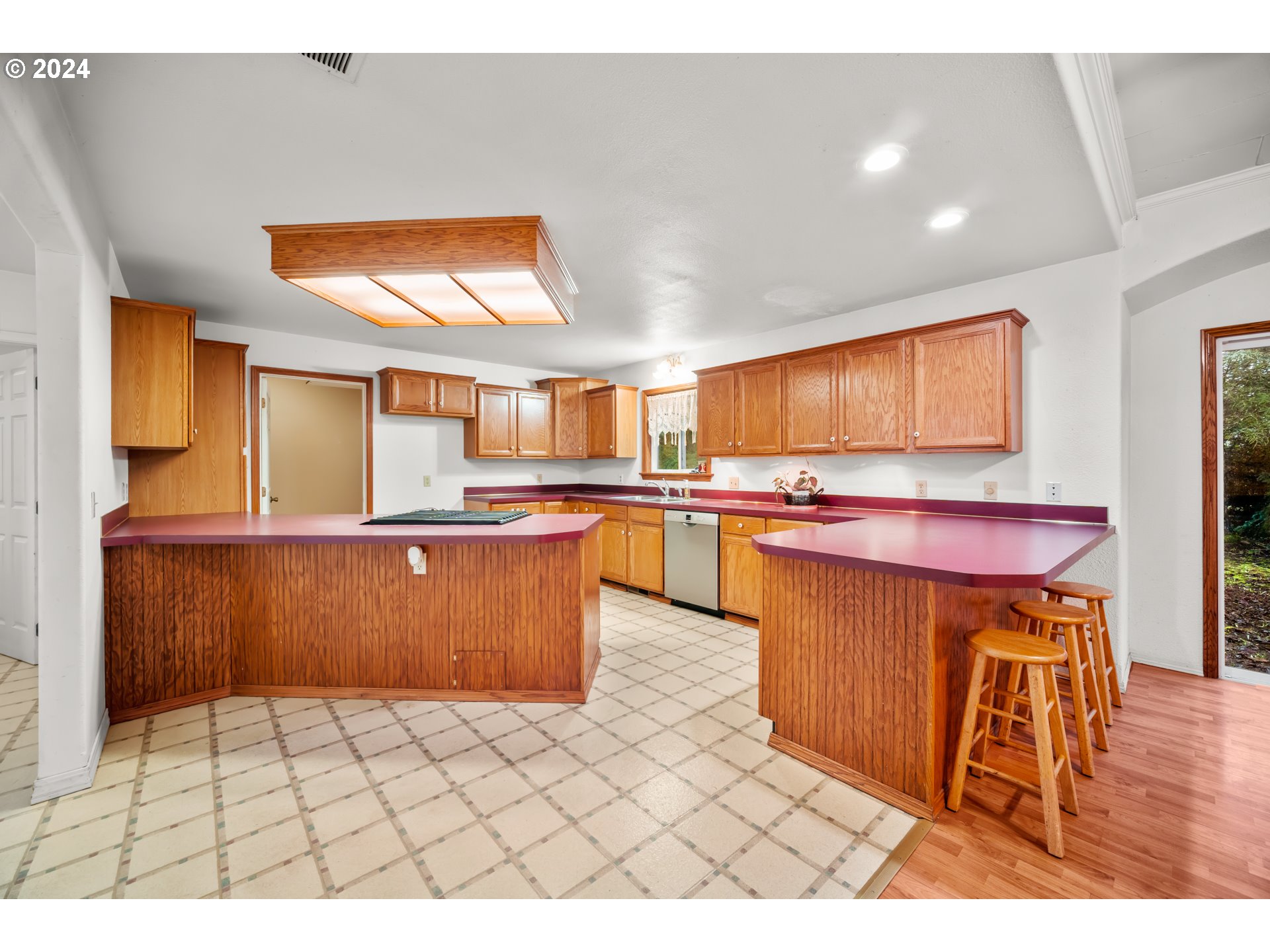 225 Nikula Road Winlock, WA 98596 - Photo 26 of 35 a kitchen with stainless steel appliances kitchen island granite countertop a sink and cabinets