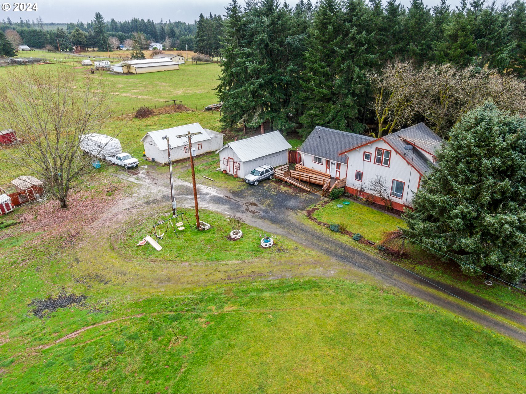 225 Nikula Road Winlock, WA 98596 - Photo 10 of 35 an aerial view of a house with garden space and outdoor seating