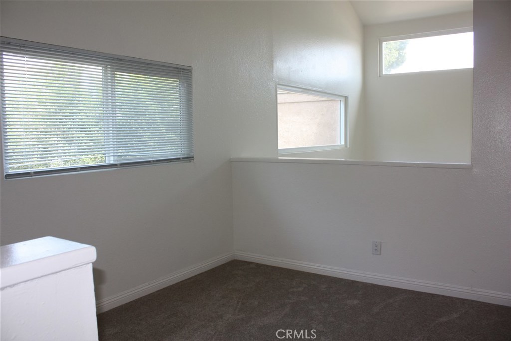 17041 A Lane, Unit B Huntington Beach, CA 92647 - Photo 12 of 16 an empty room with a window
