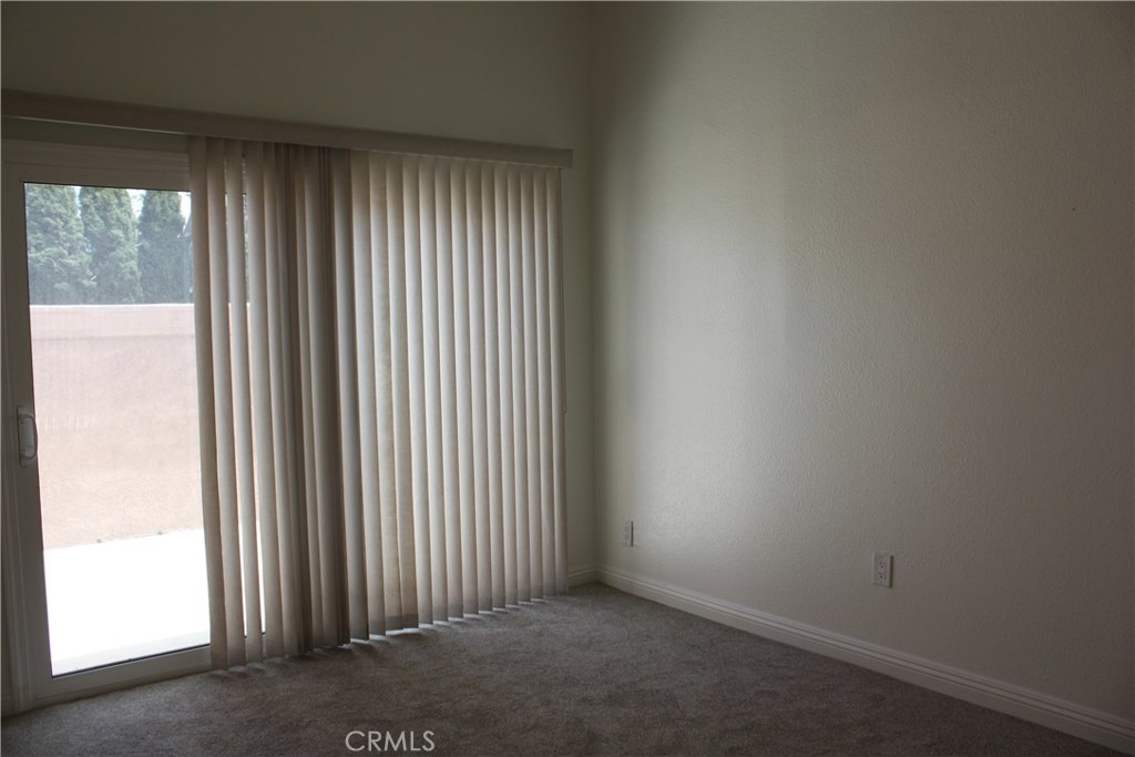 17041 A Lane, Unit B Huntington Beach, CA 92647 - Photo 6 of 16 an empty room with windows