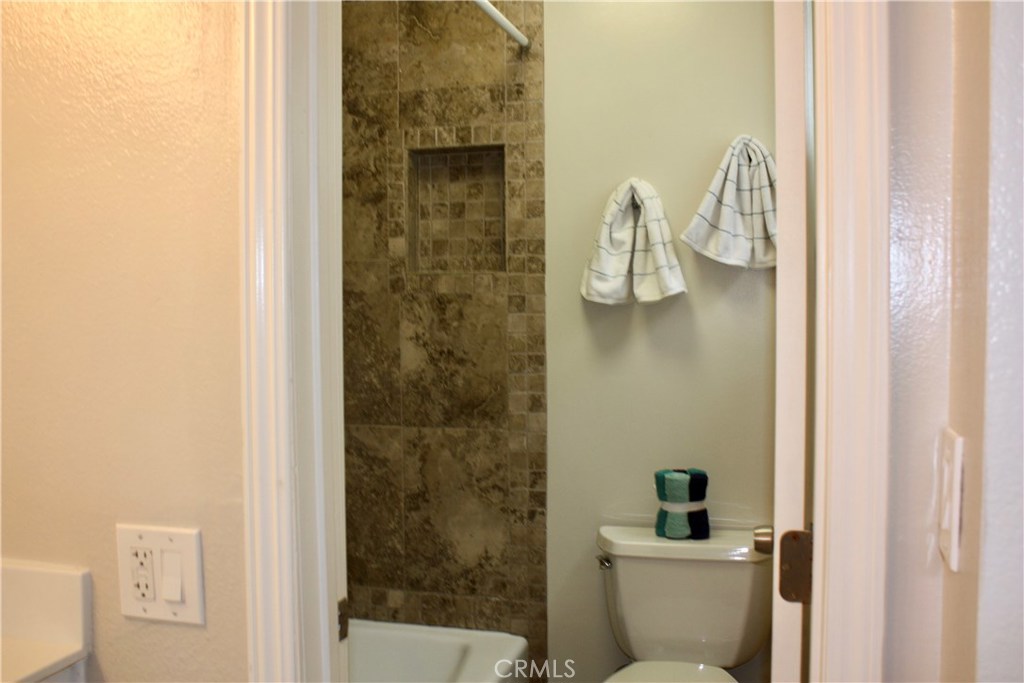 17041 A Lane, Unit B Huntington Beach, CA 92647 - Photo 8 of 16 a bathroom with a shower
